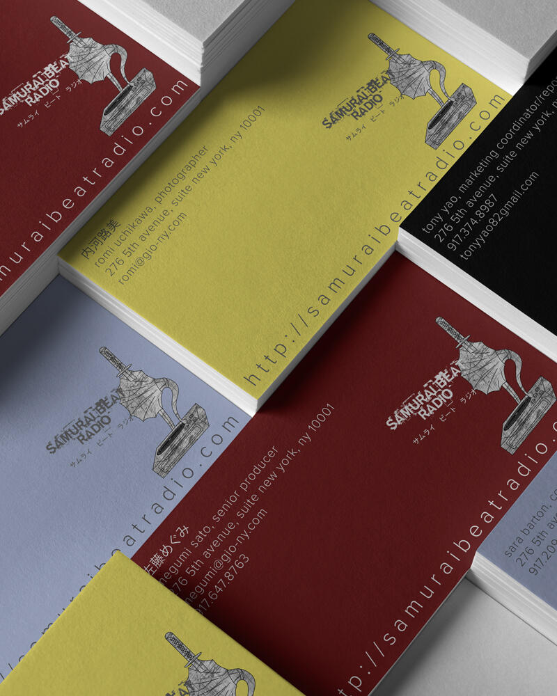Close up of Samurai Beat Radio business cards in various colors.